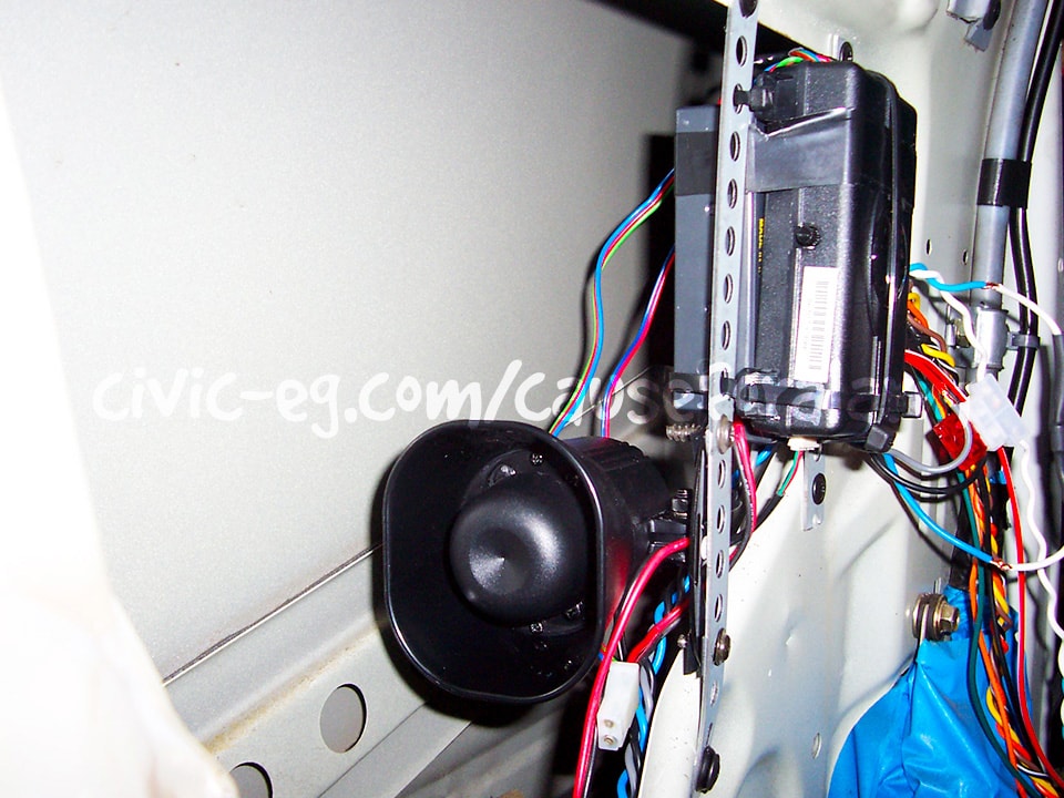 side view of alarm, siren, and backup battery
